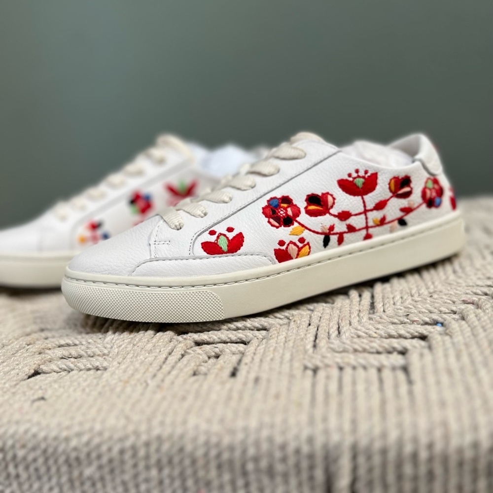 Never worn Soludos white leather sneakers with red embroidered flowers.